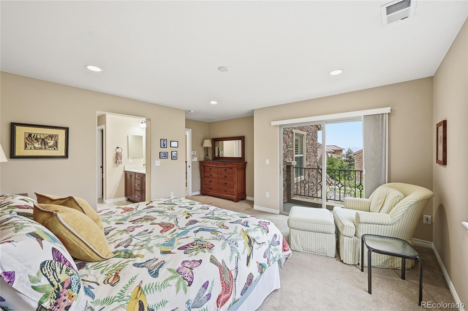 9500 Pendio Court Highlands Ranch, CO 80126 - Photo 9 of 15 a bedroom with a bed and a couch