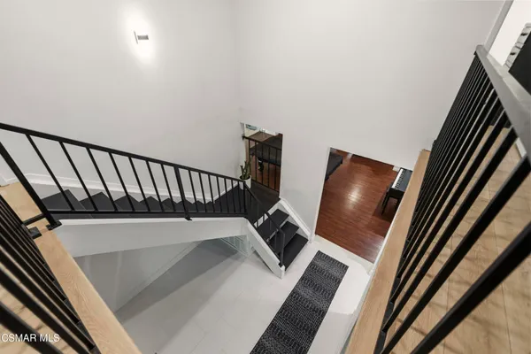 a view of staircase and wooden floor