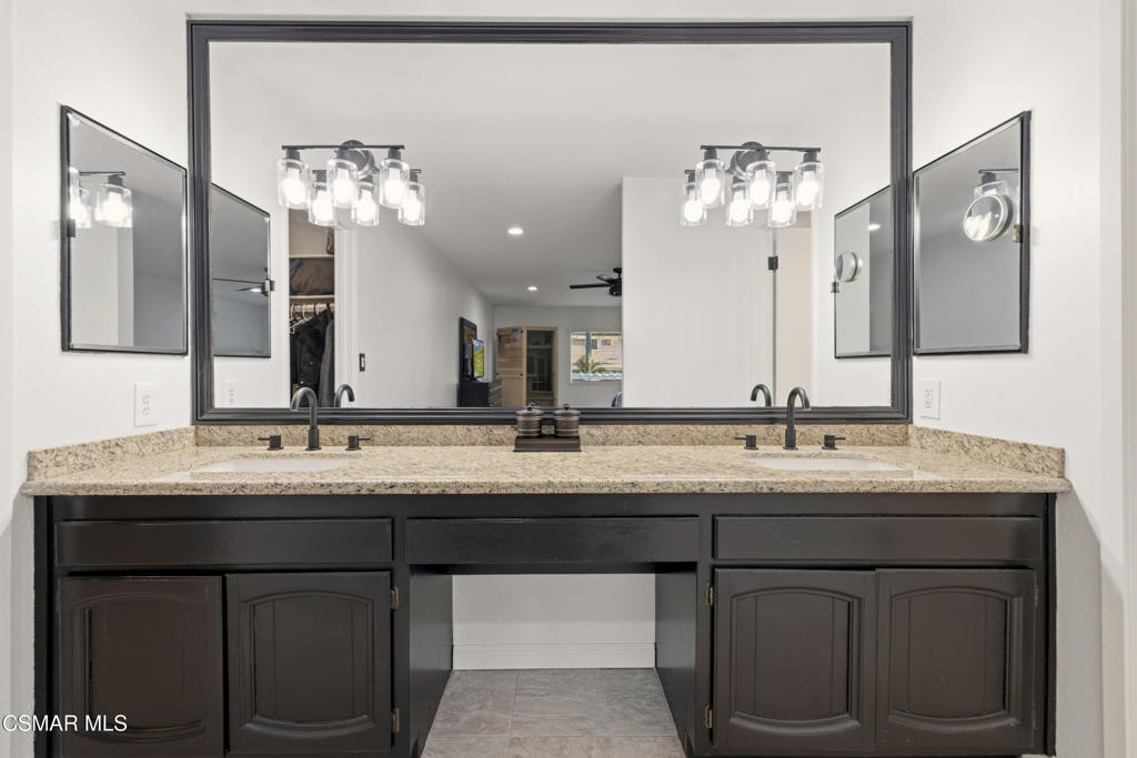 2371 Larch Street Simi Valley, CA 93065 - Photo 23 of 40 a bathroom with a double vanity sink and a mirror