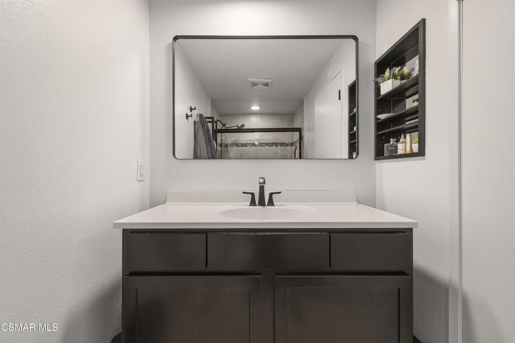 2371 Larch Street Simi Valley, CA 93065 - Photo 31 of 40 a kitchen with a sink and a mirror