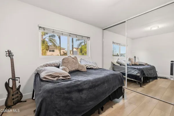 a bedroom with bed and window