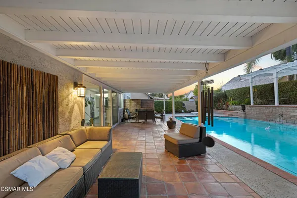 a outdoor space with patio lots of furniture and garden view