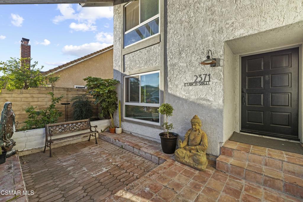 2371 Larch Street Simi Valley, CA 93065 - Photo 8 of 40 a bench is sitting in front of a building
