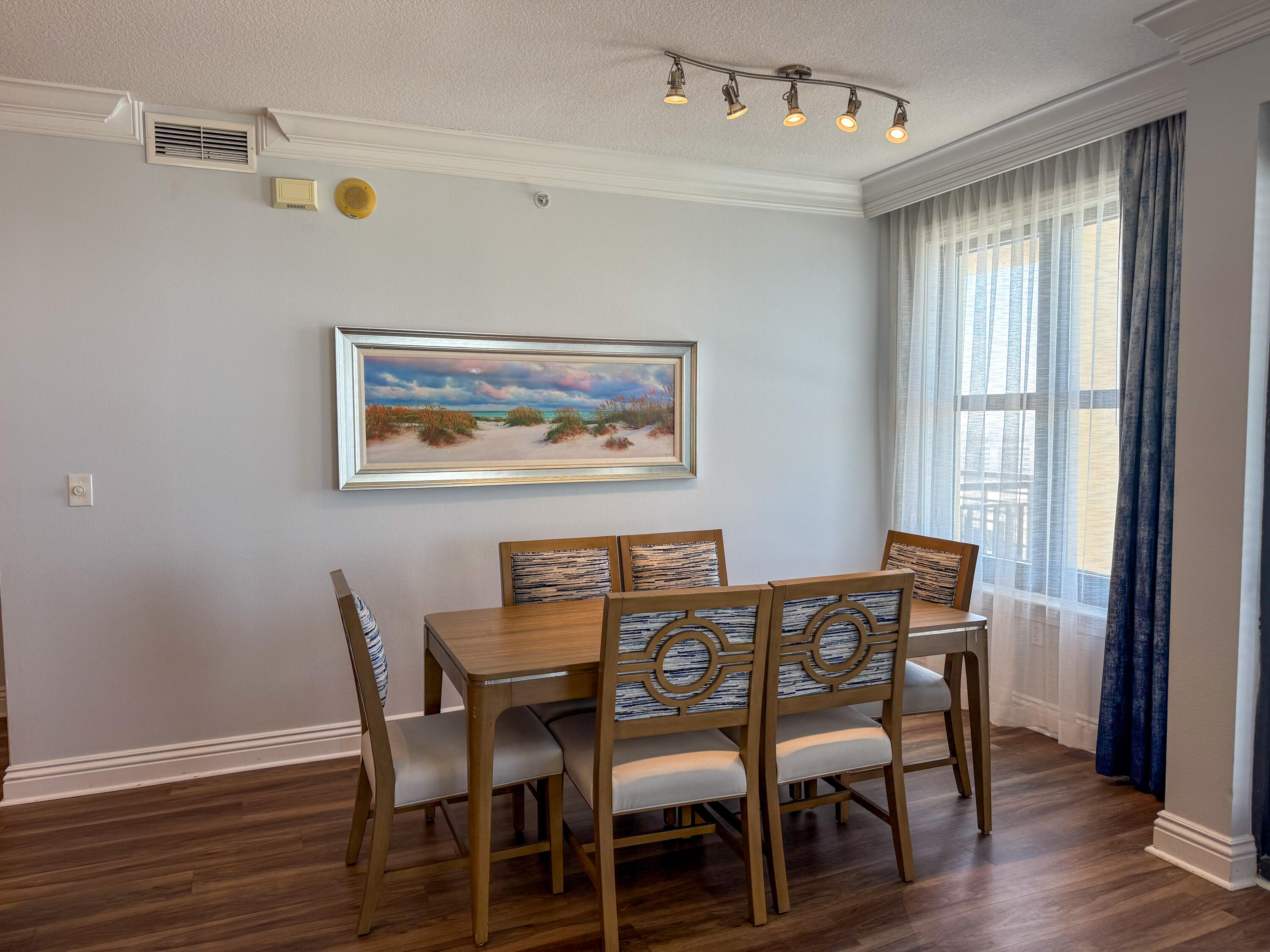 10 Harbor Boulevard, Unit E505F Destin, FL 32541 - Photo 4 of 25 a view of a dining room with furniture window and wooden floor