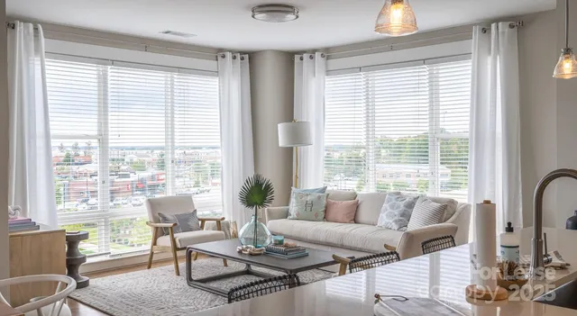 a bathroom with a granite countertop sink a toilet a mirror and shower