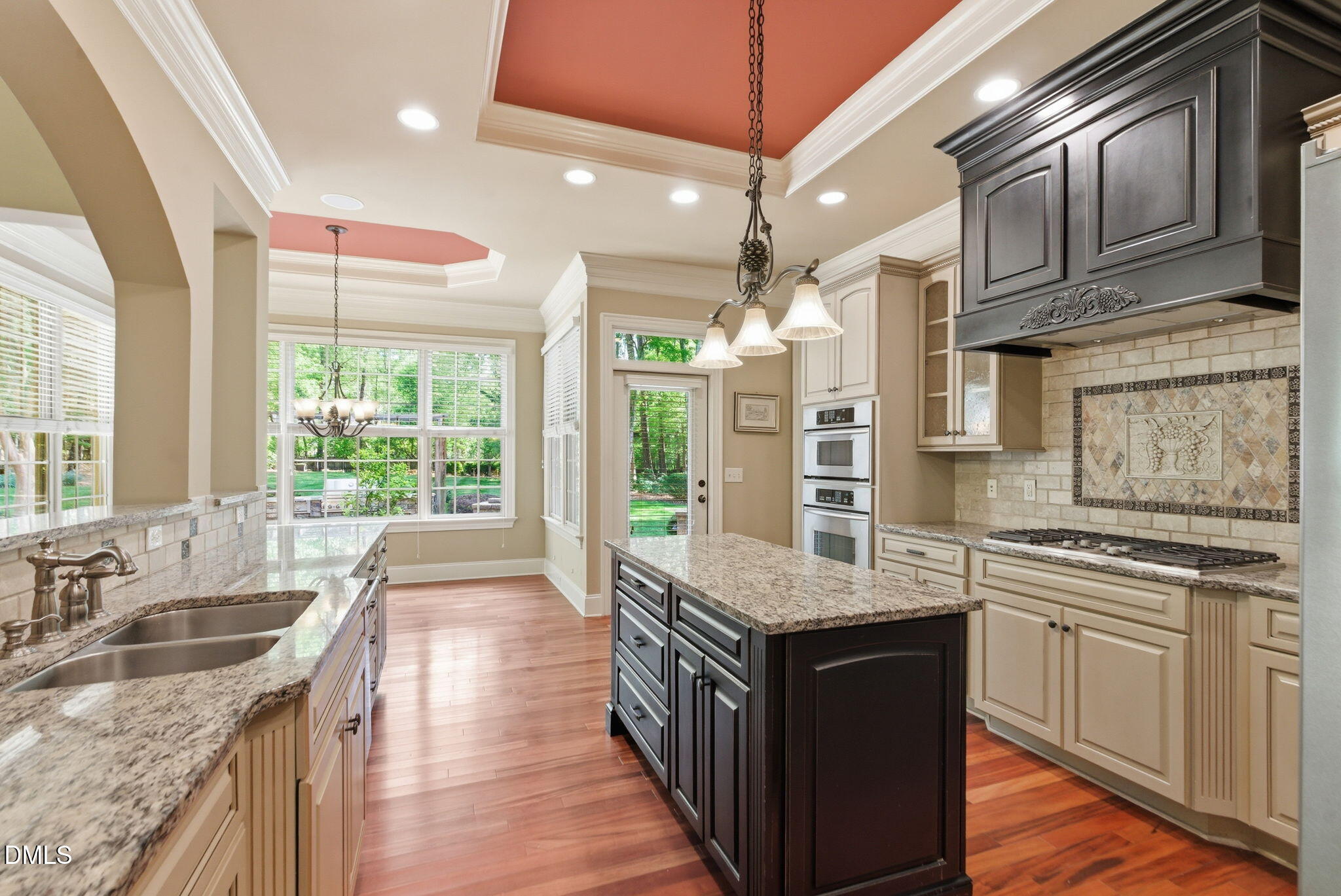 2008 Peaceful Road Wake Forest, NC 27587 - Photo 16 of 89 a kitchen with stainless steel appliances granite countertop a sink a stove top oven a counter space and cabinets