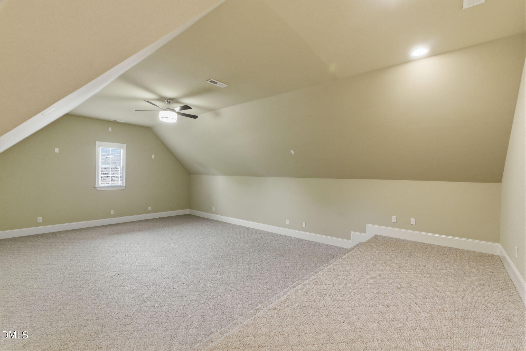 2008 Peaceful Road Wake Forest, NC 27587 - Photo 51 of 89 an empty room with a chandelier fan and windows