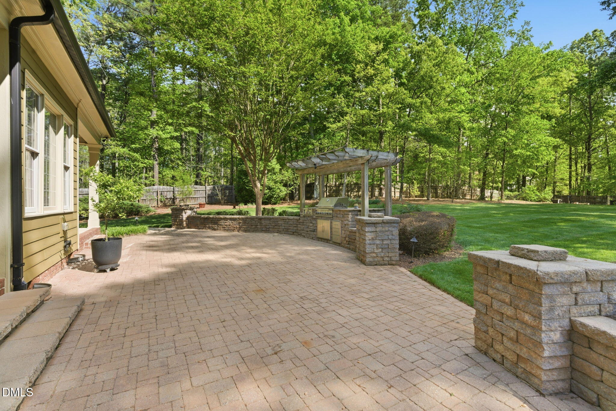 2008 Peaceful Road Wake Forest, NC 27587 - Photo 64 of 89 a view of a patio with table and chairs potted plants and large tree