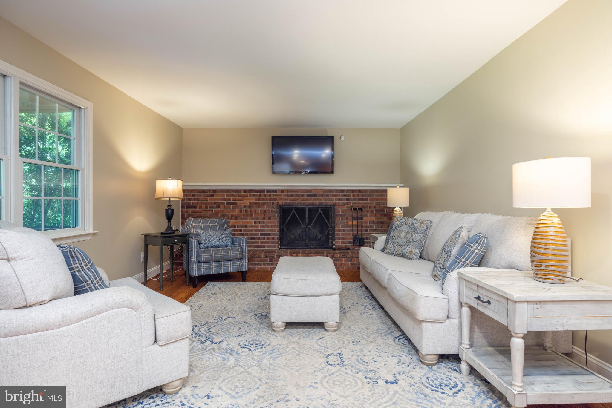 17 Bridleshire Road Newark, DE 19711 - Photo 11 of 62 a living room with furniture and a fireplace