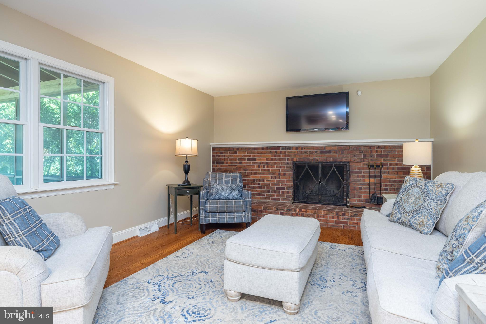 17 Bridleshire Road Newark, DE 19711 - Photo 12 of 62 a living room with furniture and a fireplace