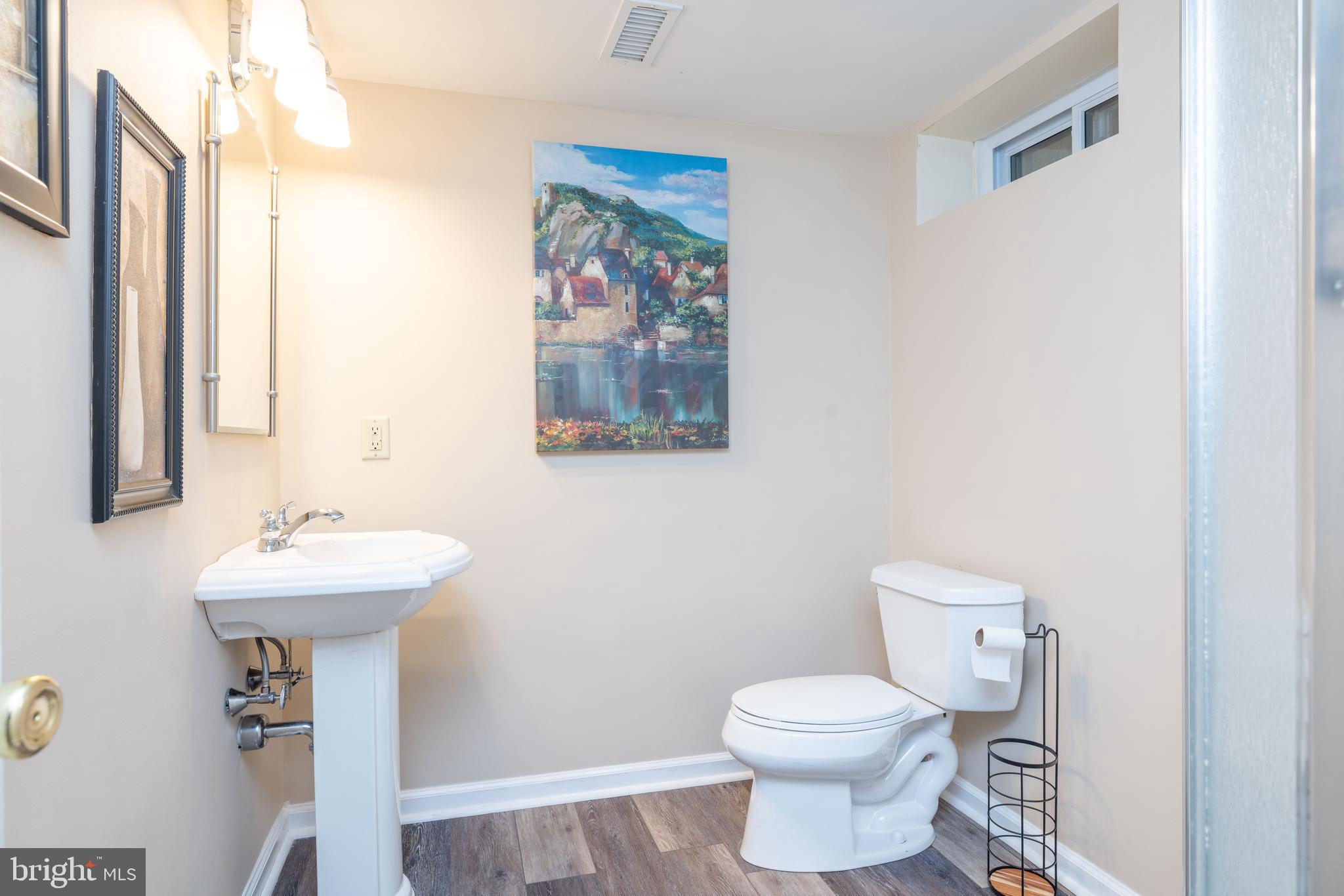 17 Bridleshire Road Newark, DE 19711 - Photo 45 of 62 a bathroom with a sink mirror and toilet