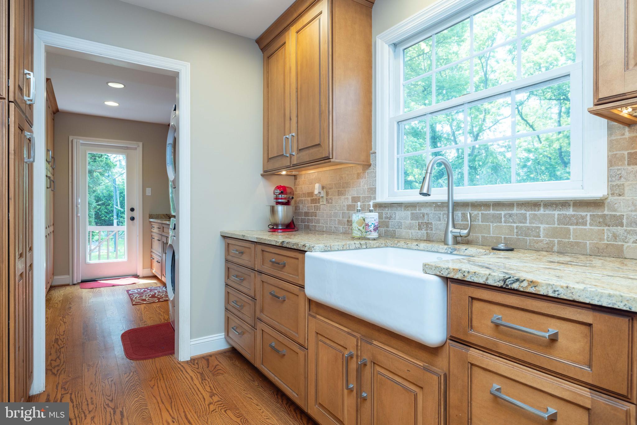 17 Bridleshire Road Newark, DE 19711 - Photo 7 of 62 a kitchen with a sink cabinets appliances and a window