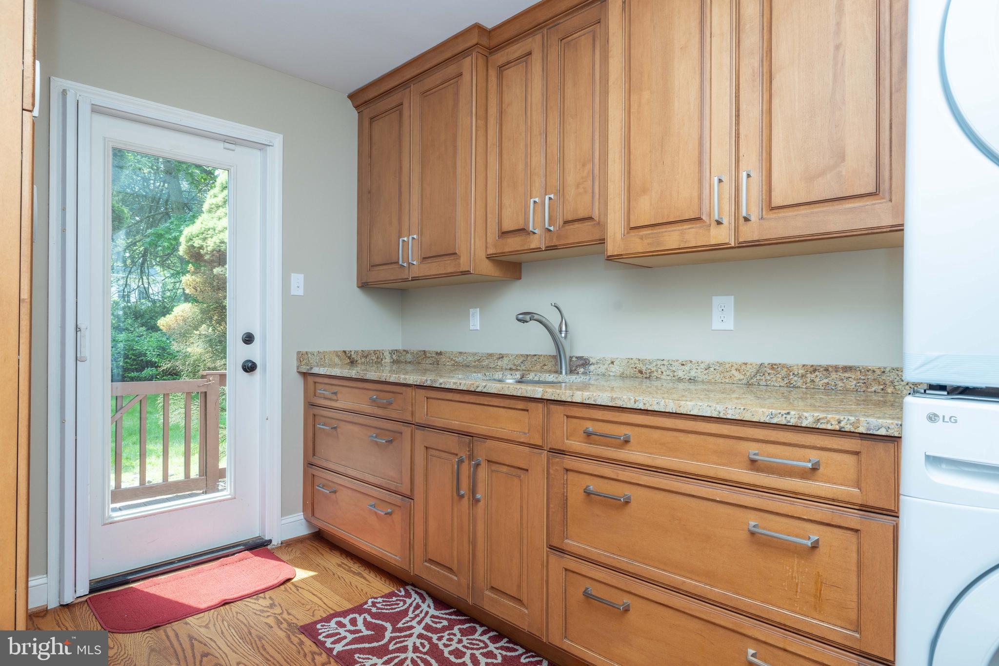 17 Bridleshire Road Newark, DE 19711 - Photo 9 of 62 a kitchen with granite countertop stainless steel appliances white cabinets and a sink