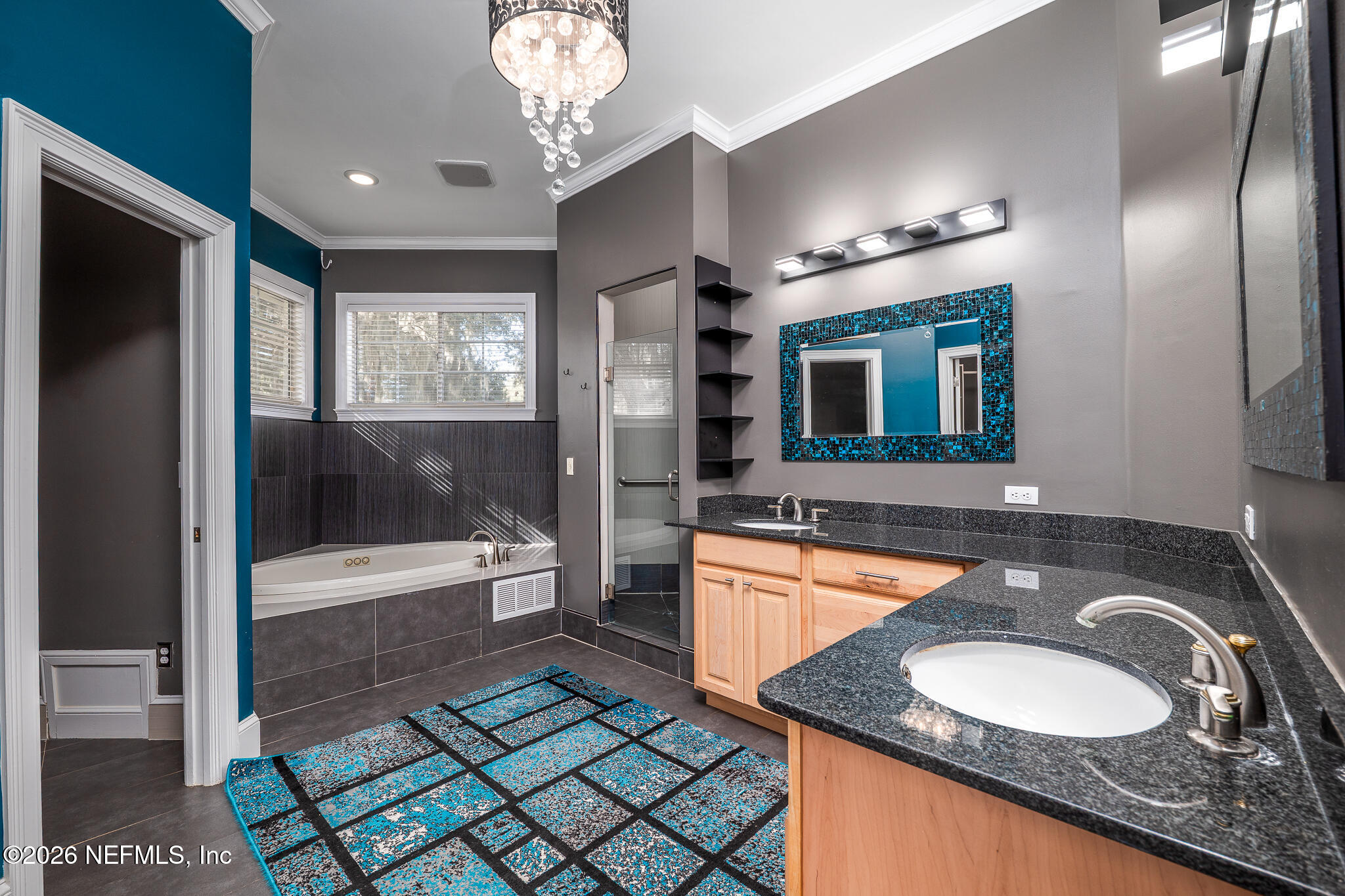 707 Standish Court St. Augustine, FL 32086 - Photo 21 of 69 a bathroom with a granite countertop double vanity sink a mirror and a bathtub