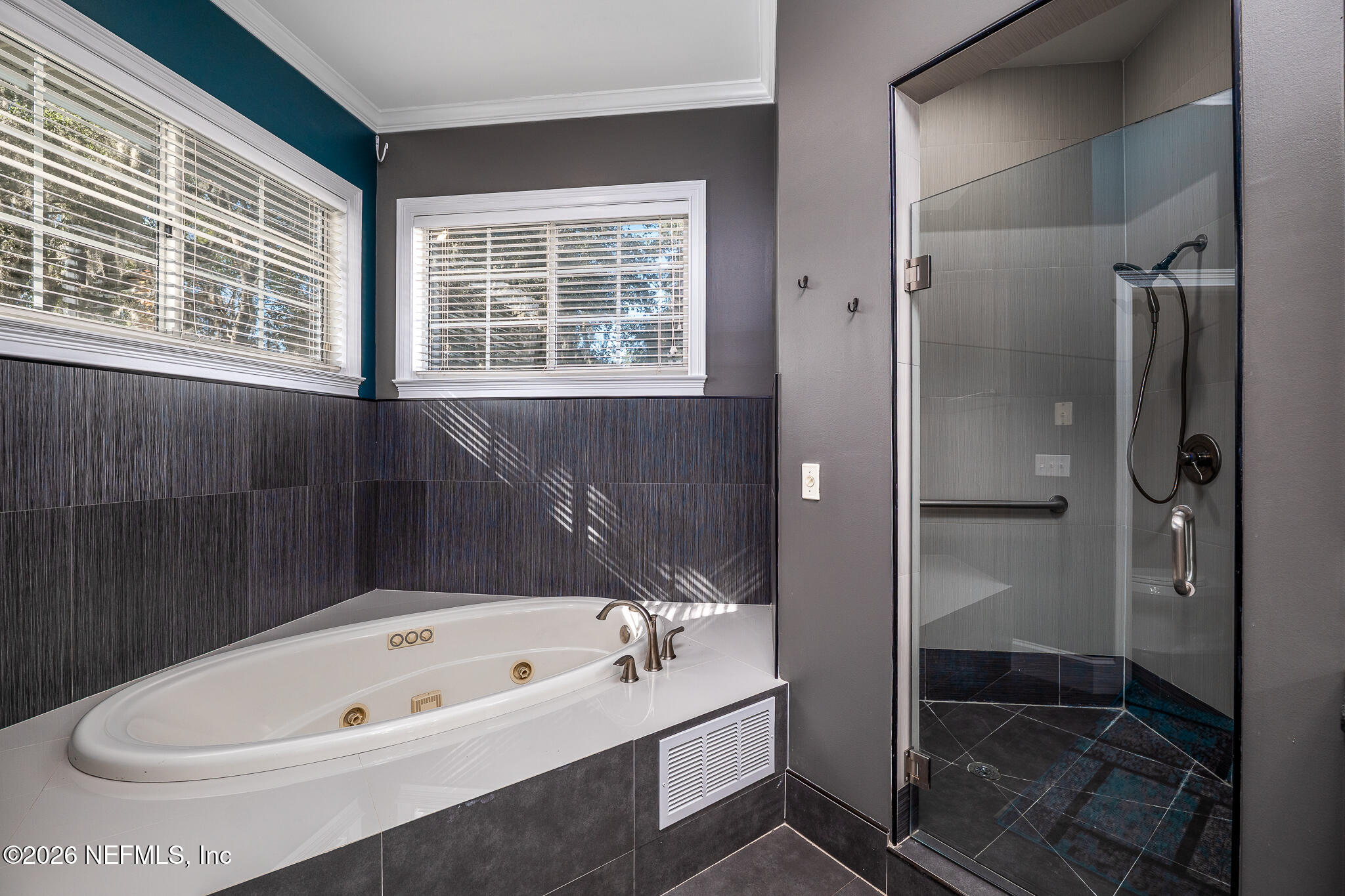 707 Standish Court St. Augustine, FL 32086 - Photo 22 of 69 a bathroom with a tub a sink and shower