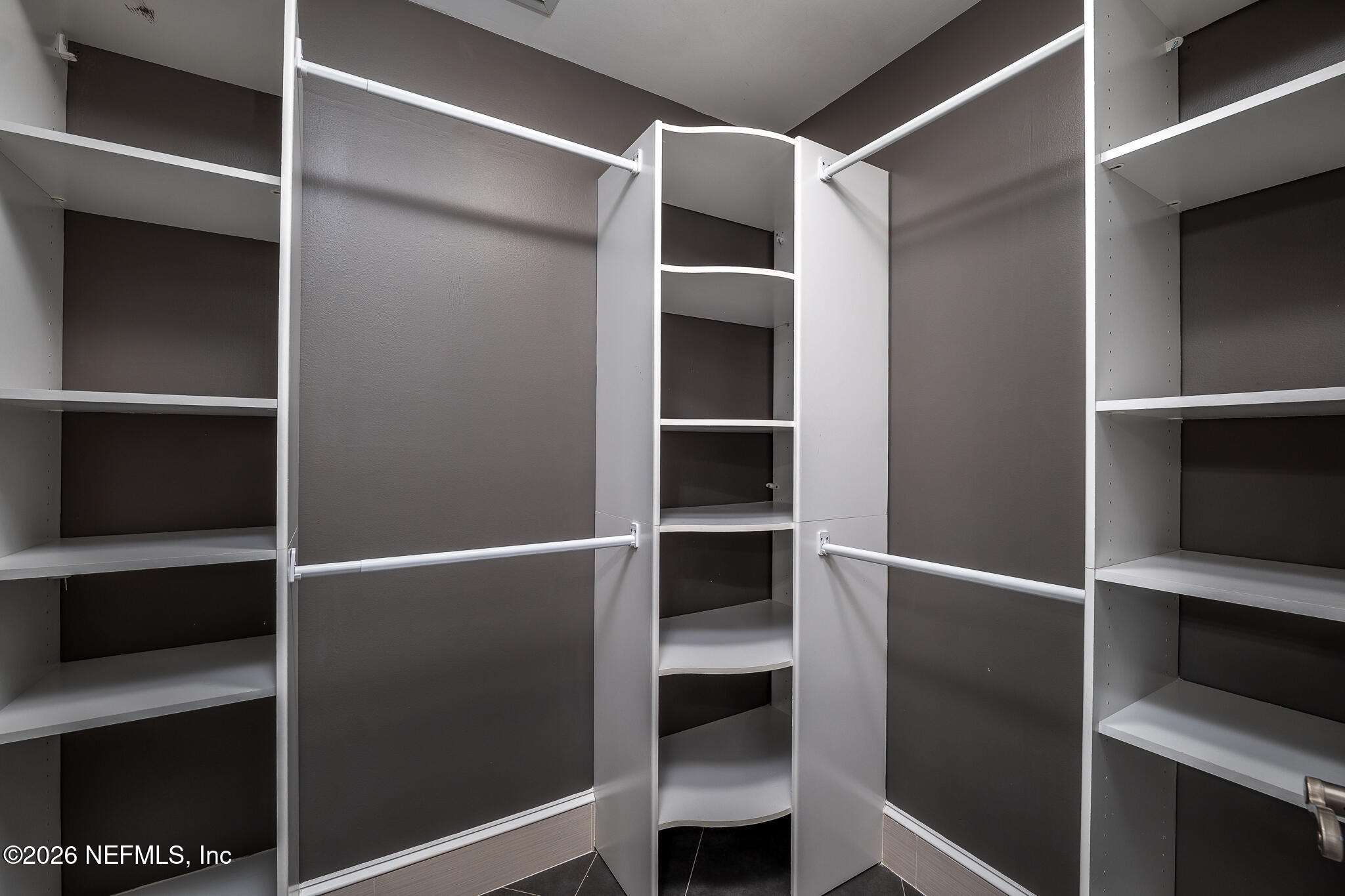 707 Standish Court St. Augustine, FL 32086 - Photo 24 of 69 a view of walk in closet with empty racks