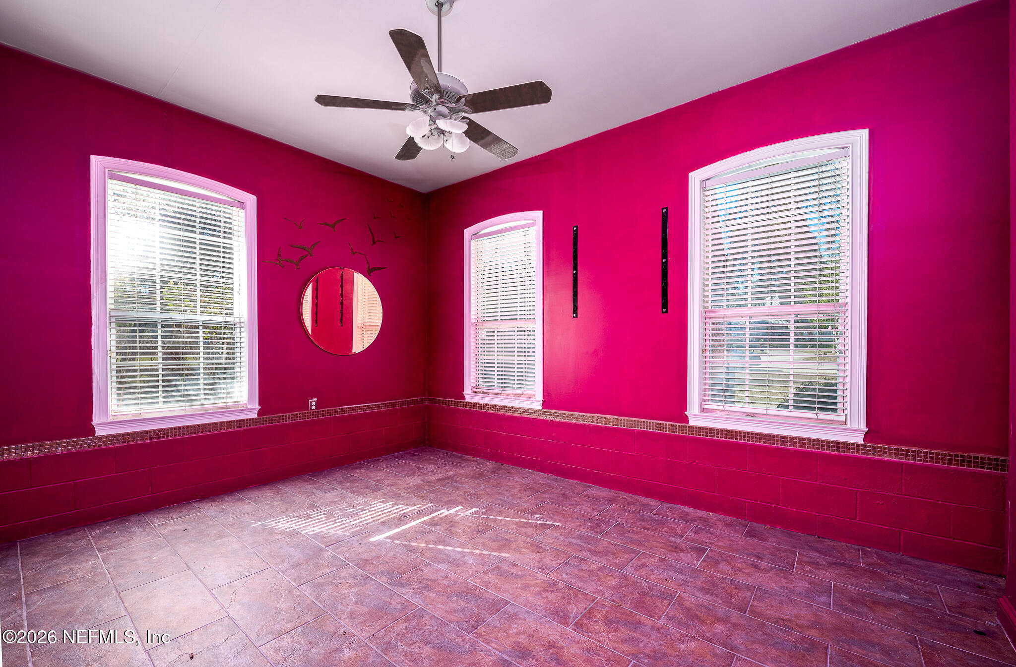 707 Standish Court St. Augustine, FL 32086 - Photo 37 of 69 a view of an empty room with window chandelier fan and windows