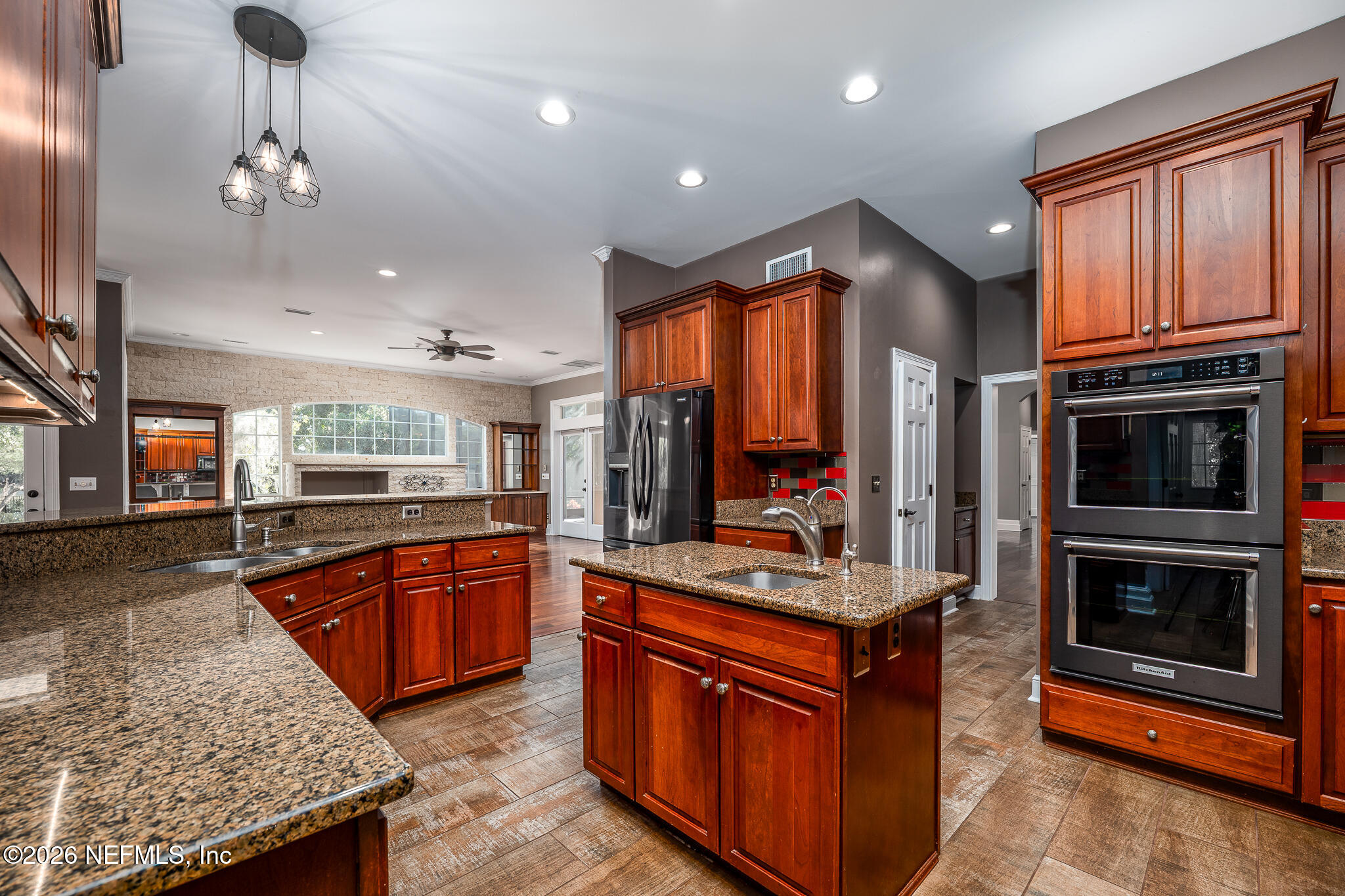 707 Standish Court St. Augustine, FL 32086 - Photo 4 of 69 a kitchen with stainless steel appliances granite countertop a stove and a sink