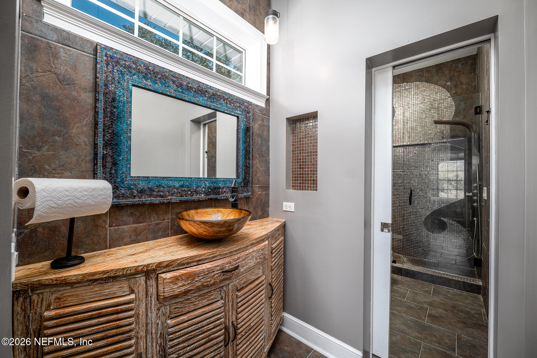 707 Standish Court St. Augustine, FL 32086 - Photo 41 of 69 a bathroom with a granite countertop sink a mirror and shower