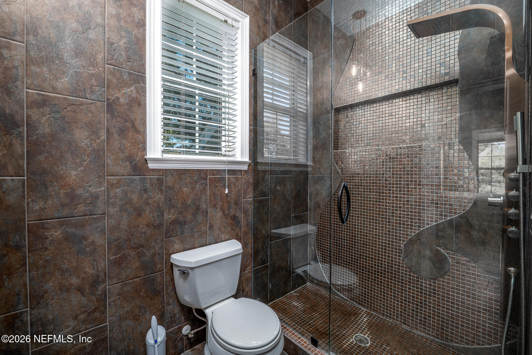 707 Standish Court St. Augustine, FL 32086 - Photo 42 of 69 a white toilet sitting next to a bathroom sink