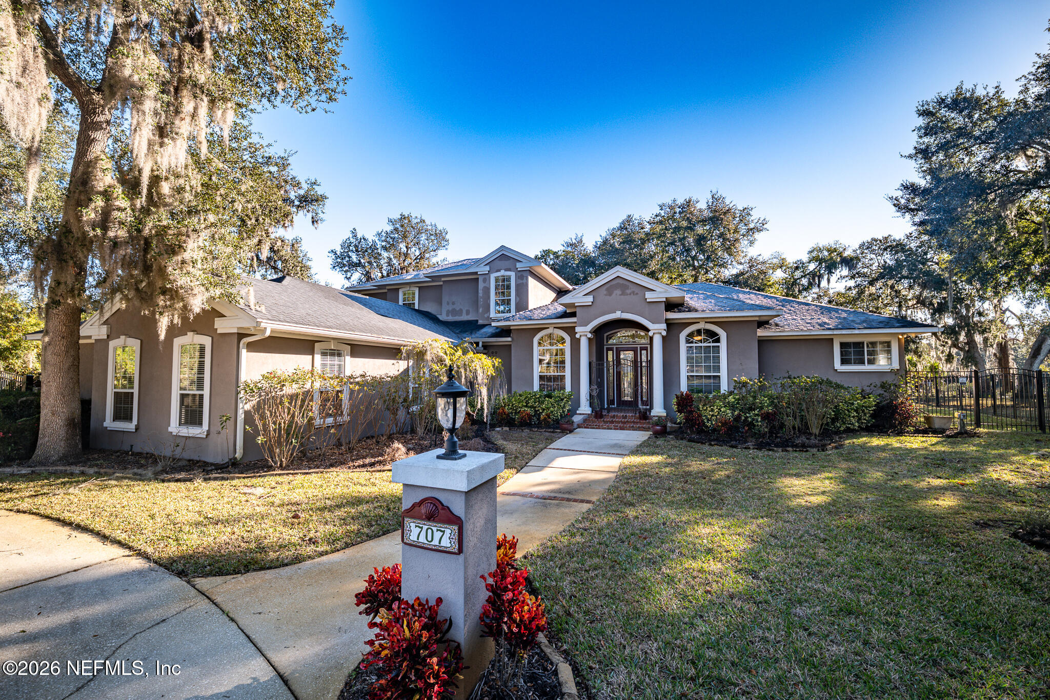 707 Standish Court St. Augustine, FL 32086 - Photo 10 of 69 a front view of a house with yard and green space
