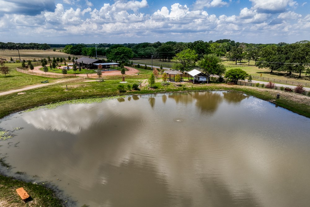 35418 Tompkins Road Hempstead, TX 77445 - Photo 39 of 50 a view of a lake with houses