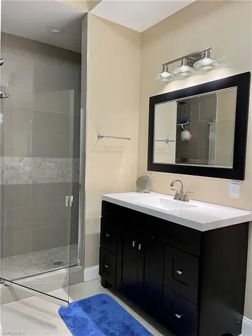 a bathroom with a sink and mirror