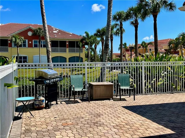 a view of a chairs and tables in the patio