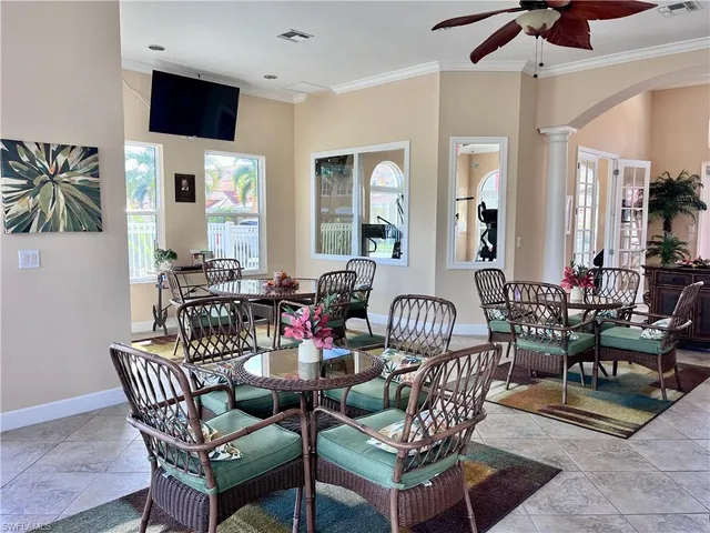 a dining room with furniture and wooden floor