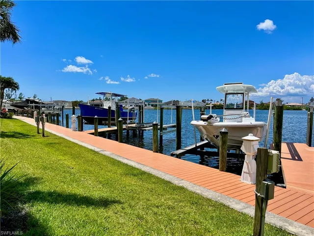 a view of a chairs and table in patio