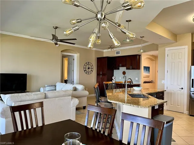 a very nice looking dining room with a table and chairs