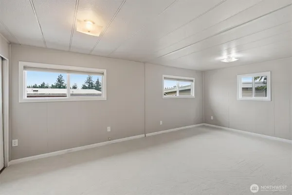 a view of an empty room with windows