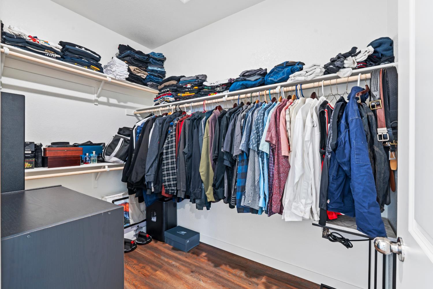 5713 Natalie Way Keyes, CA 95328 - Photo 13 of 30 a view of walk in closet with clothes and shoes