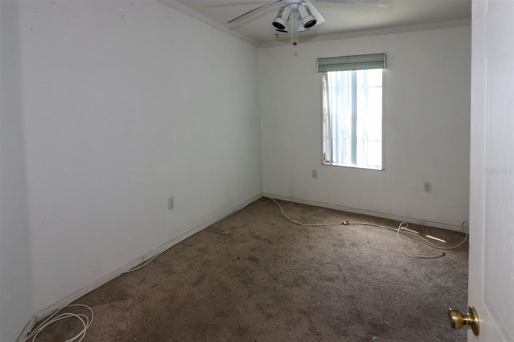 29200 South Jones Loop Road, Unit 205 Punta Gorda, FL 33950 - Photo 12 of 25 an empty room with a window