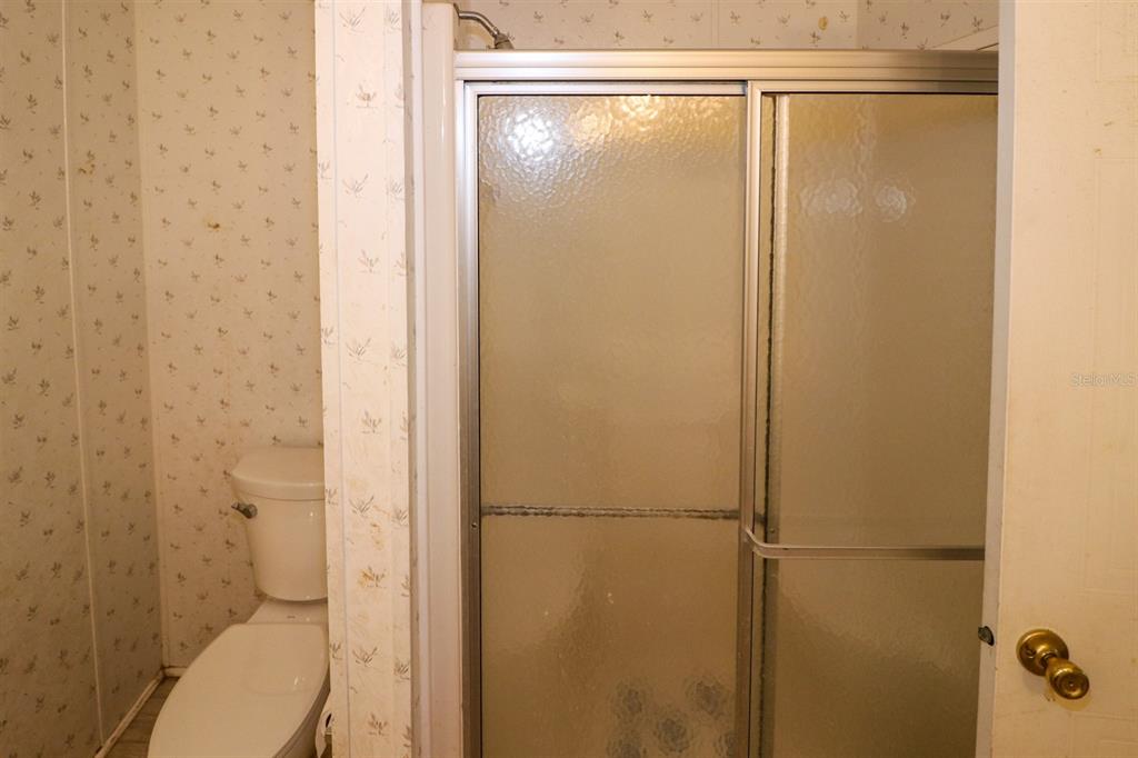 29200 South Jones Loop Road, Unit 205 Punta Gorda, FL 33950 - Photo 18 of 25 a bathroom with a shower and a toilet