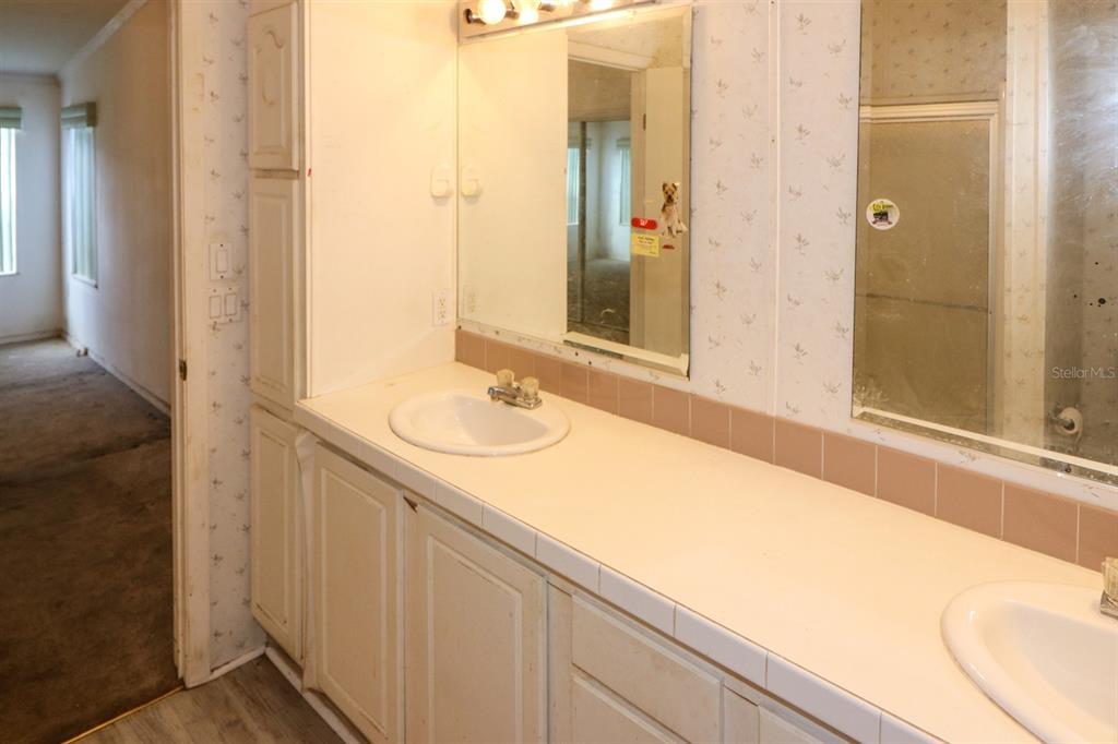 29200 South Jones Loop Road, Unit 205 Punta Gorda, FL 33950 - Photo 19 of 25 a bathroom with a sink and a mirror