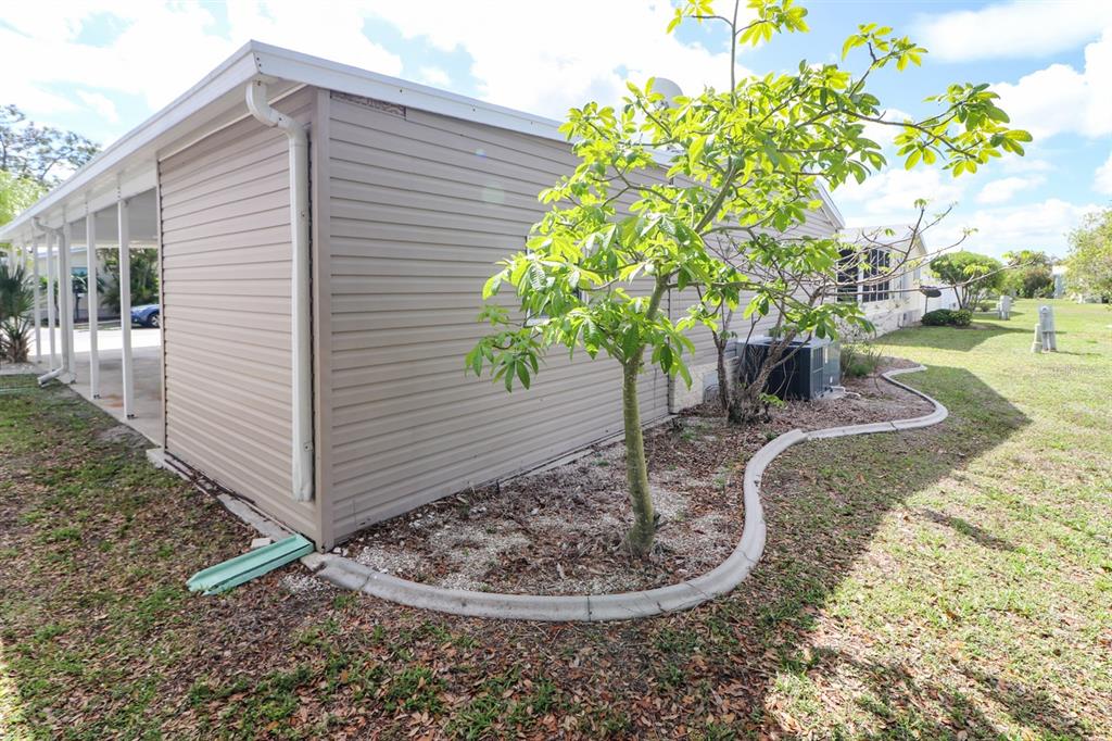 29200 South Jones Loop Road, Unit 205 Punta Gorda, FL 33950 - Photo 24 of 25 a vase of flowers sitting on a table