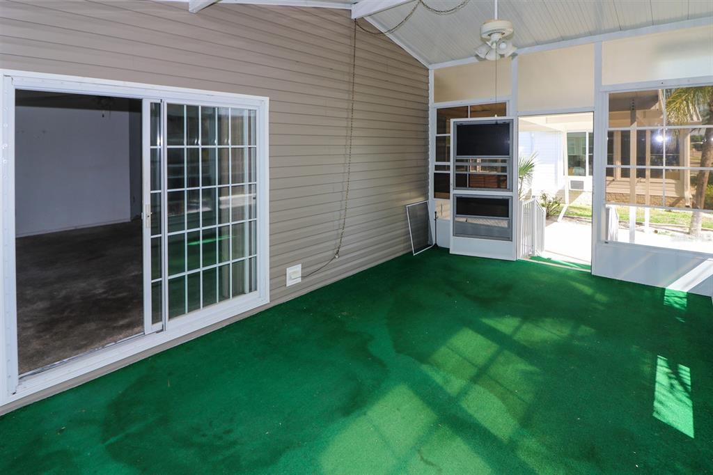 29200 South Jones Loop Road, Unit 205 Punta Gorda, FL 33950 - Photo 3 of 25 a view of an house with backyard and a garden