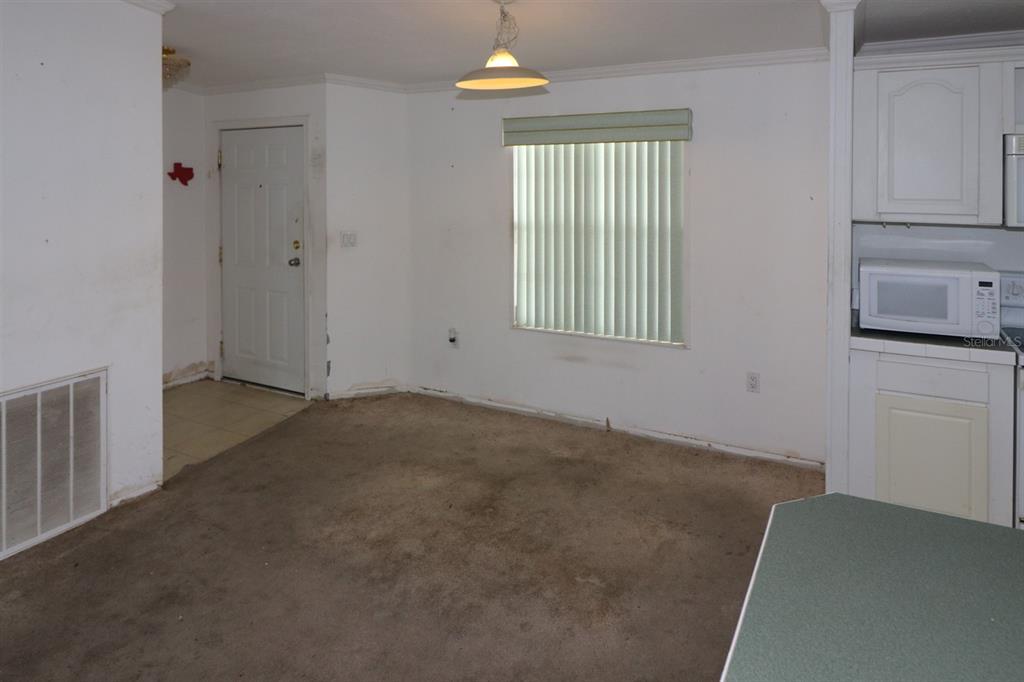 29200 South Jones Loop Road, Unit 205 Punta Gorda, FL 33950 - Photo 8 of 25 an empty room with windows