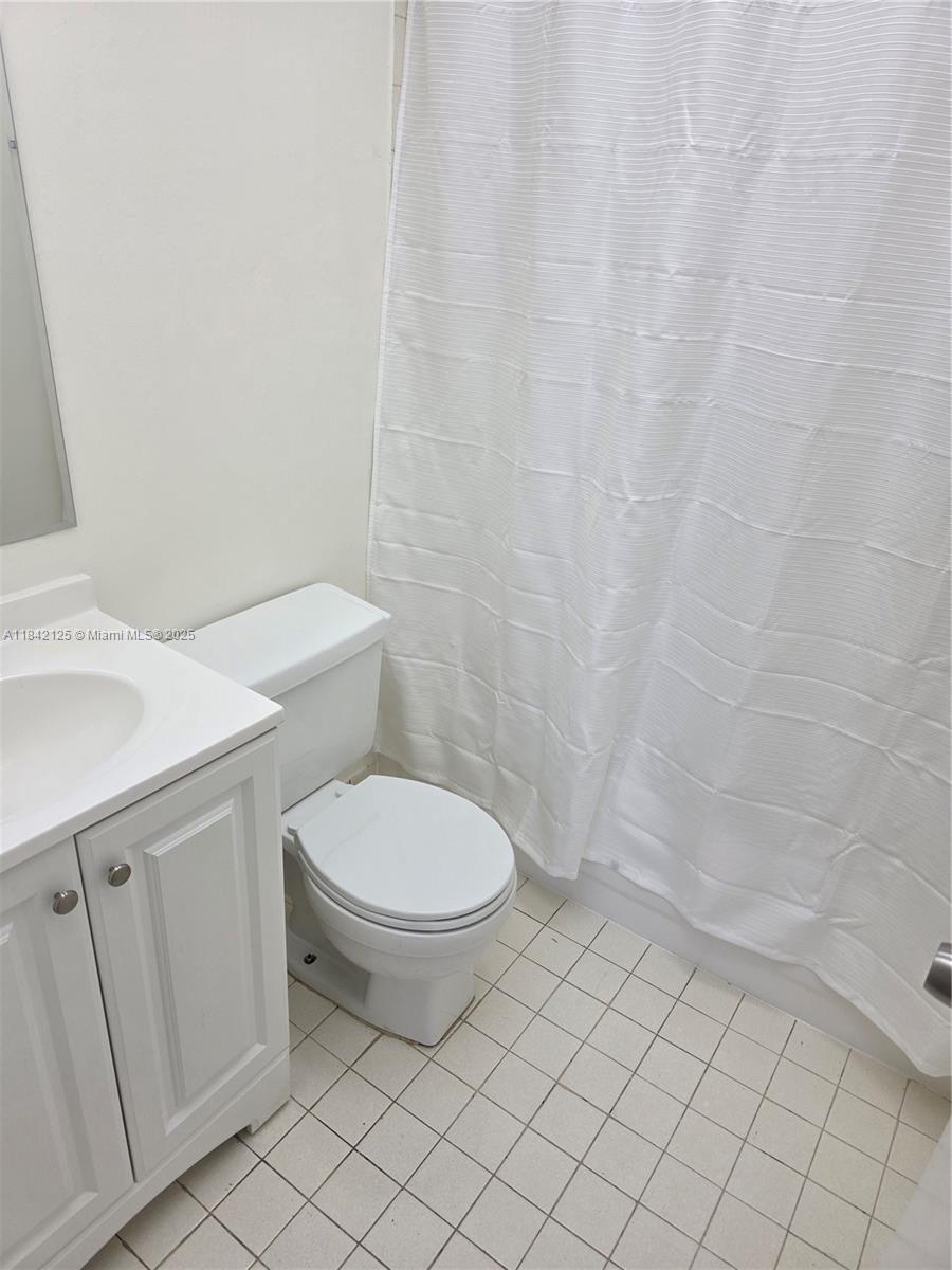 1121 Southwest 105th Avenue, Unit 322 Miami, FL 33174 - Photo 11 of 19 a white toilet sitting next to a white sink