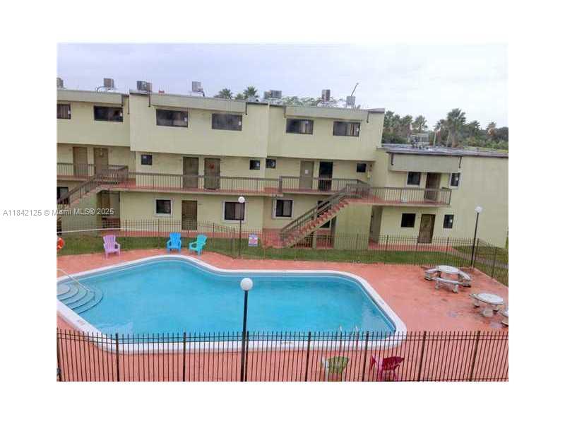 1121 Southwest 105th Avenue, Unit 322 Miami, FL 33174 - Photo 16 of 19 a aerial view of a house with swimming pool
