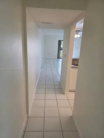 a view of a bathroom with a sink and a mirror