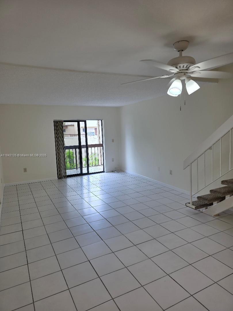 1121 Southwest 105th Avenue, Unit 322 Miami, FL 33174 - Photo 7 of 19 a view of an empty room with a window