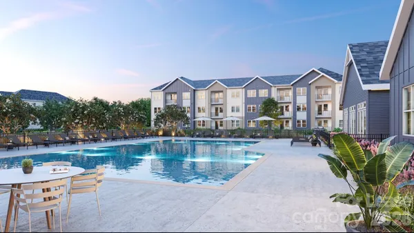 a view of a house with pool and a chairs