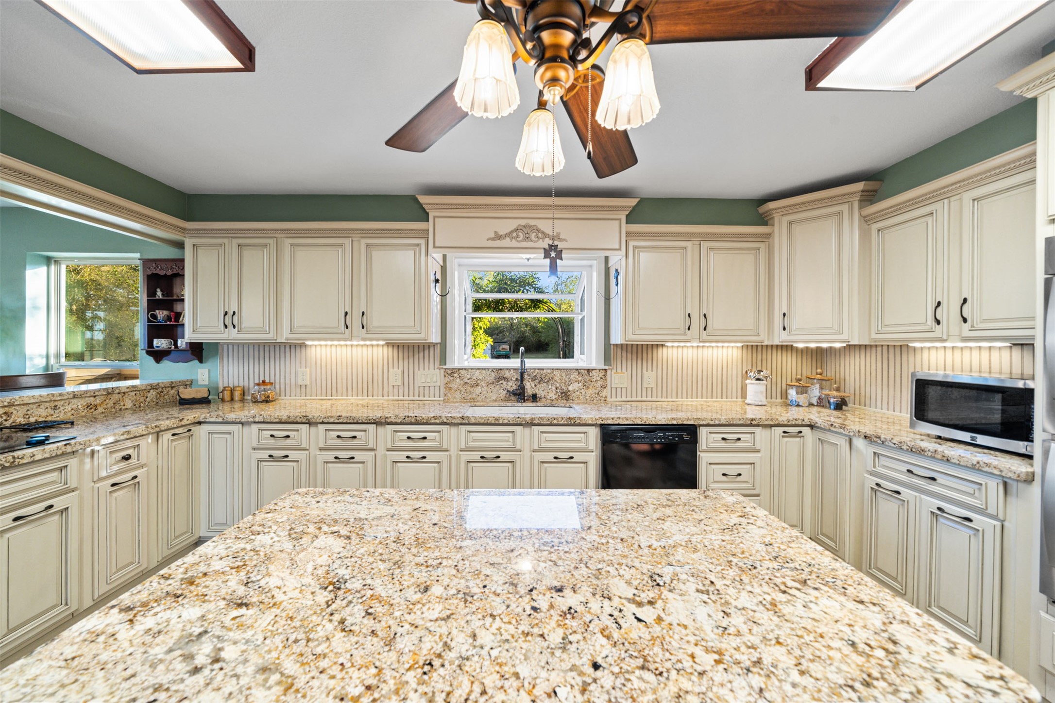 25948 Nelson Road Hempstead, TX 77445 - Photo 12 of 50 a kitchen with stainless steel appliances granite countertop a stove sink and cabinets