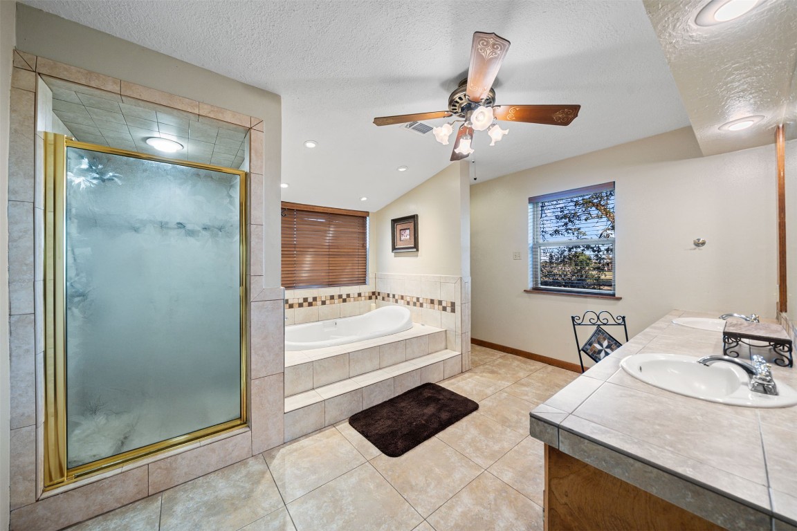 25948 Nelson Road Hempstead, TX 77445 - Photo 23 of 50 a bathroom with a sink a mirror and a shower