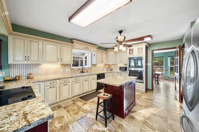 a view of a livingroom with furniture window and wooden floor