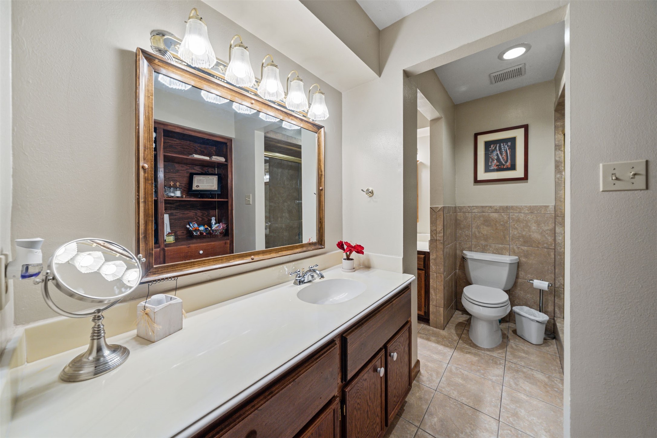 25948 Nelson Road Hempstead, TX 77445 - Photo 27 of 50 a bathroom with a sink a toilet and a mirror
