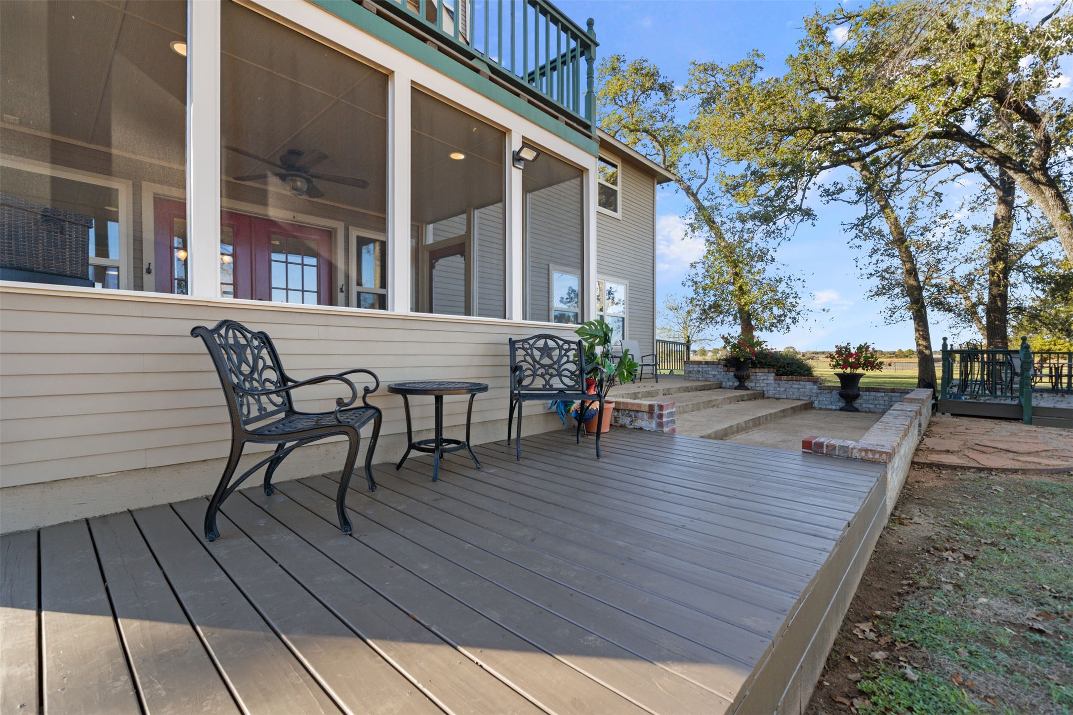 25948 Nelson Road Hempstead, TX 77445 - Photo 42 of 50 a view of a roof deck with table and chairs with wooden floor and fence
