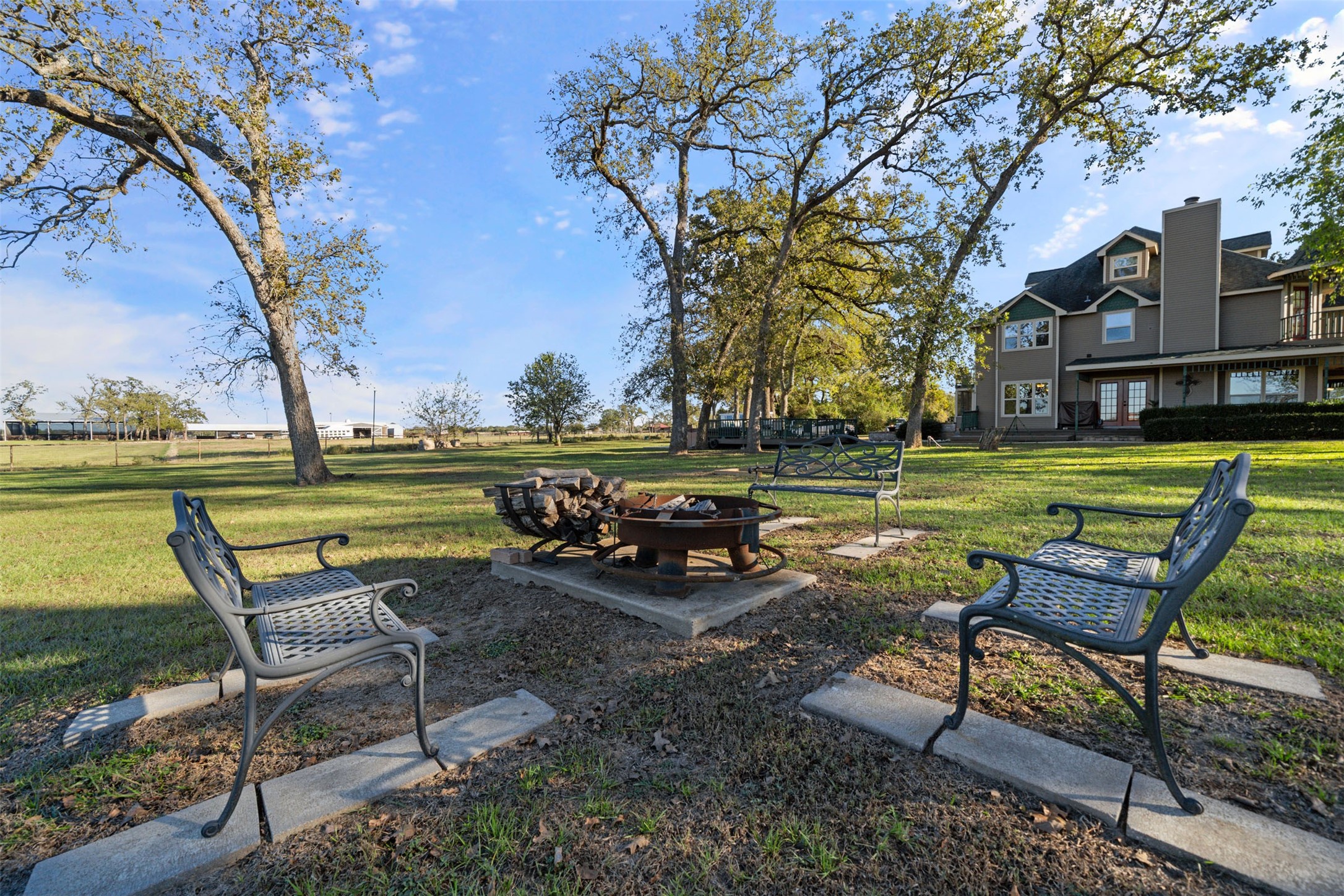 25948 Nelson Road Hempstead, TX 77445 - Photo 47 of 50 a view of a park with sitting area and wooden bench